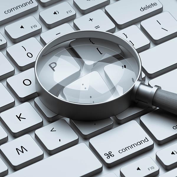 Keyboard Magnifying Glass Search Concept Magnifying glass on computer keyboard emphasizing letter P