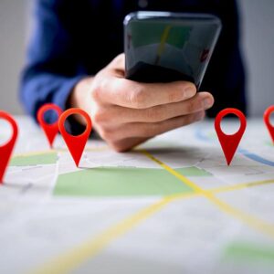 Person using smartphone to navigate map with location pins